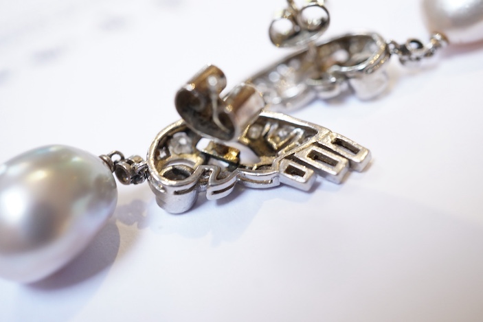 A fine pair of Art Deco natural pearl and diamond earrings, 1930s